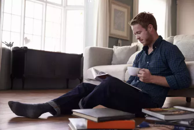 Young man reading books