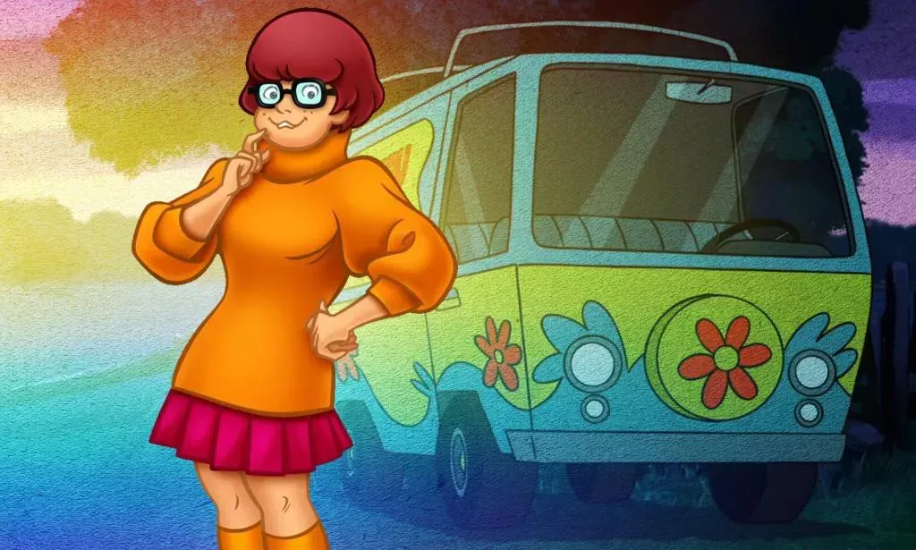 Scooby Doo character Velma stands in front of the Mystery Machine Van. (Warner Bros)