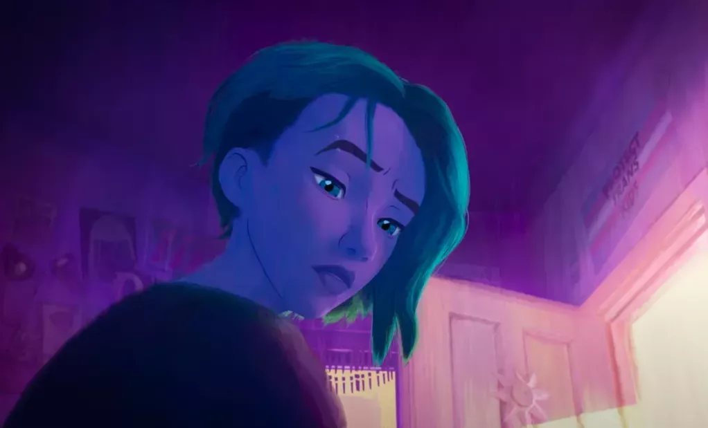 A still from the Spider-Man: Across the Spider-Verse trailer featuring Gwen Stacy with a Protect Trans Kids poster in the background