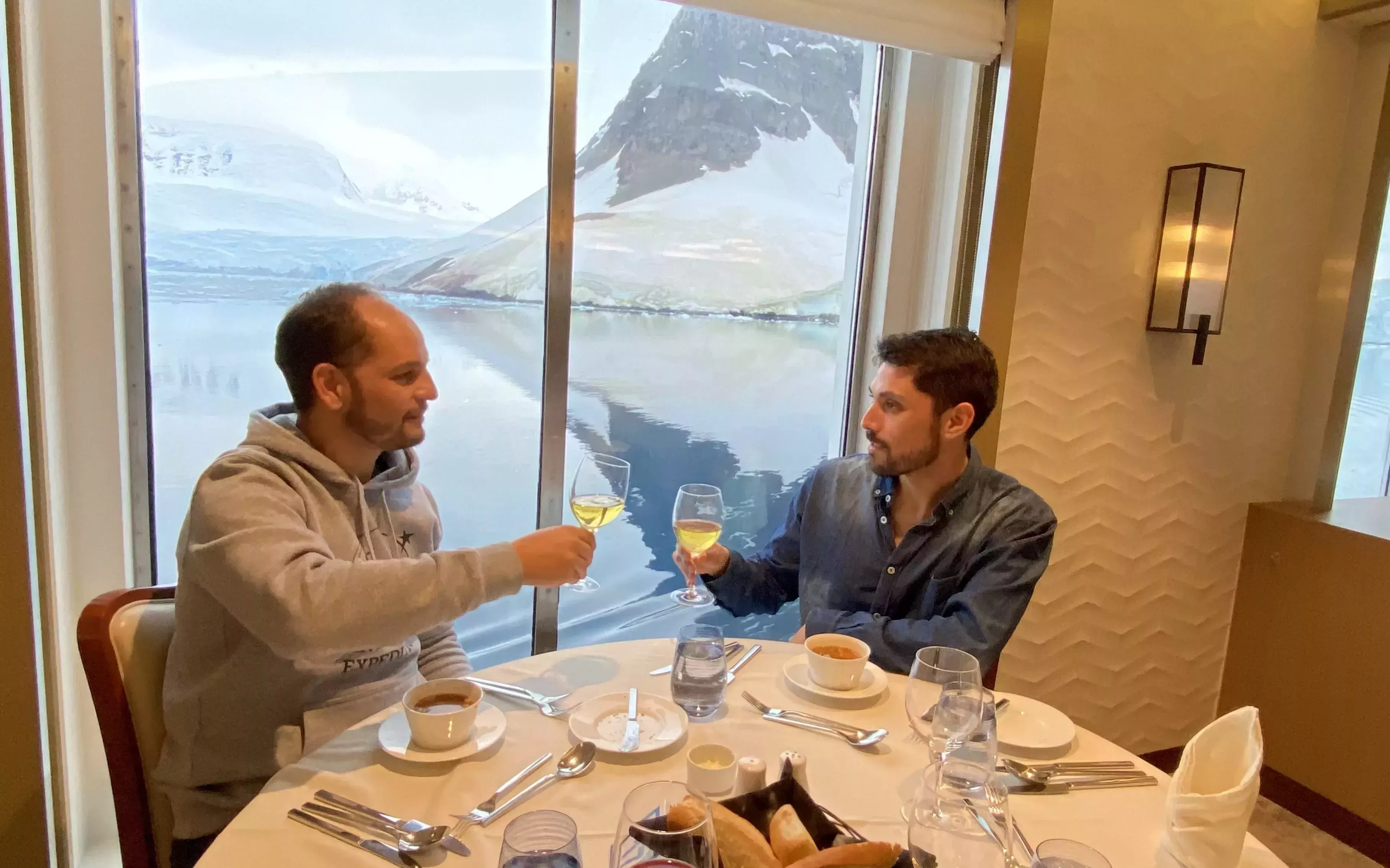 Enjoy a glass of wine on AE Expeditions Pride Voyage. 