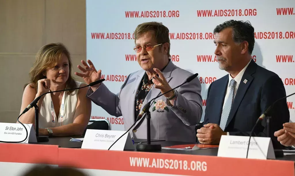 Anne Aslett, EJAF Executive Director, Sir Elton John, and John Hopkins University Professor Chris Beyrer attend the Elton John and partners launch of a new Elton John AIDS Foundation fund aimed at preventing and treating HIV in Eastern Europe and Central Asia on July 24, 2018 in Amsterdam, Netherlands.