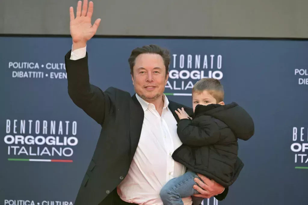 Elon Musk on a red carpet with his son X Æ A-XII.