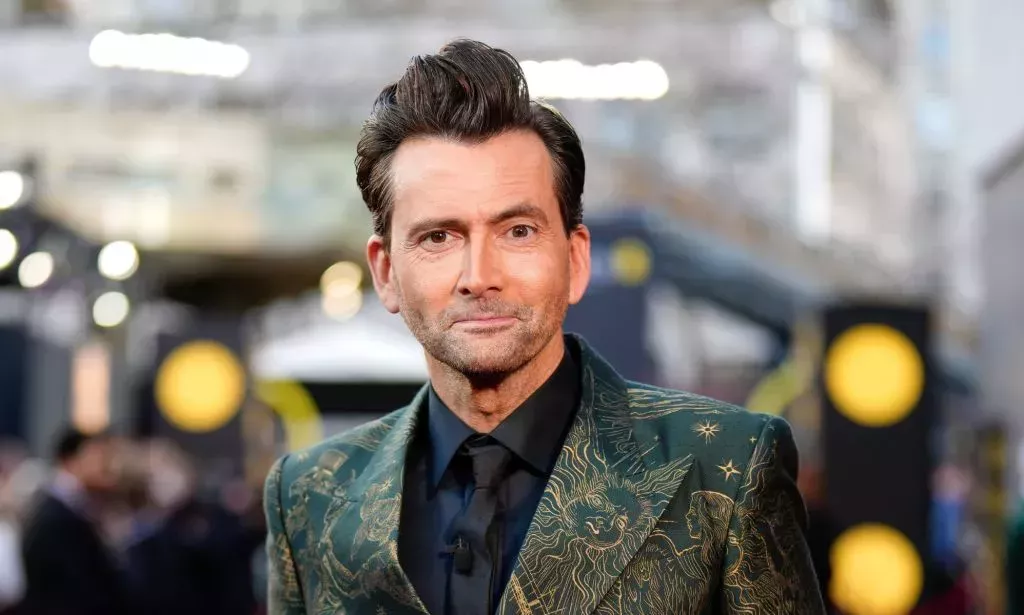 Doctor Who star David Tennant smiles on the red carpet at the 2024 BAFTA Awards.