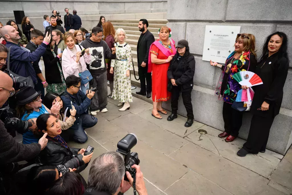 Artist Teresas Margolles (C) is seen following the unveiling of the new installation on the fourth plinth, "Mil Veces un Instante", following its unveiling at Trafalgar Square.