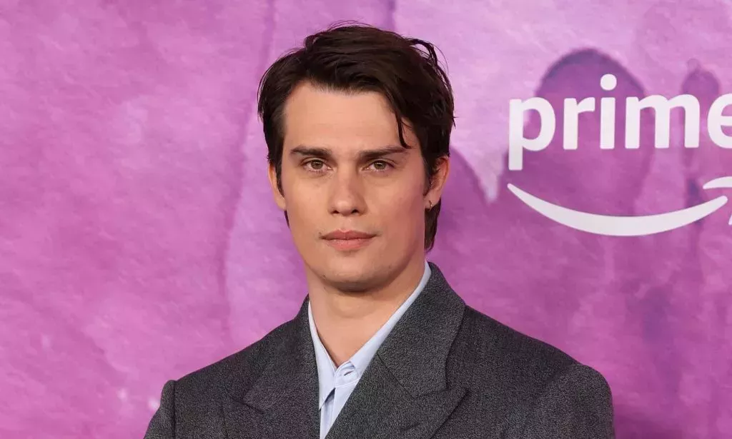 Nicholas Galitzine poses on the red carpet at the Idea of You launch.