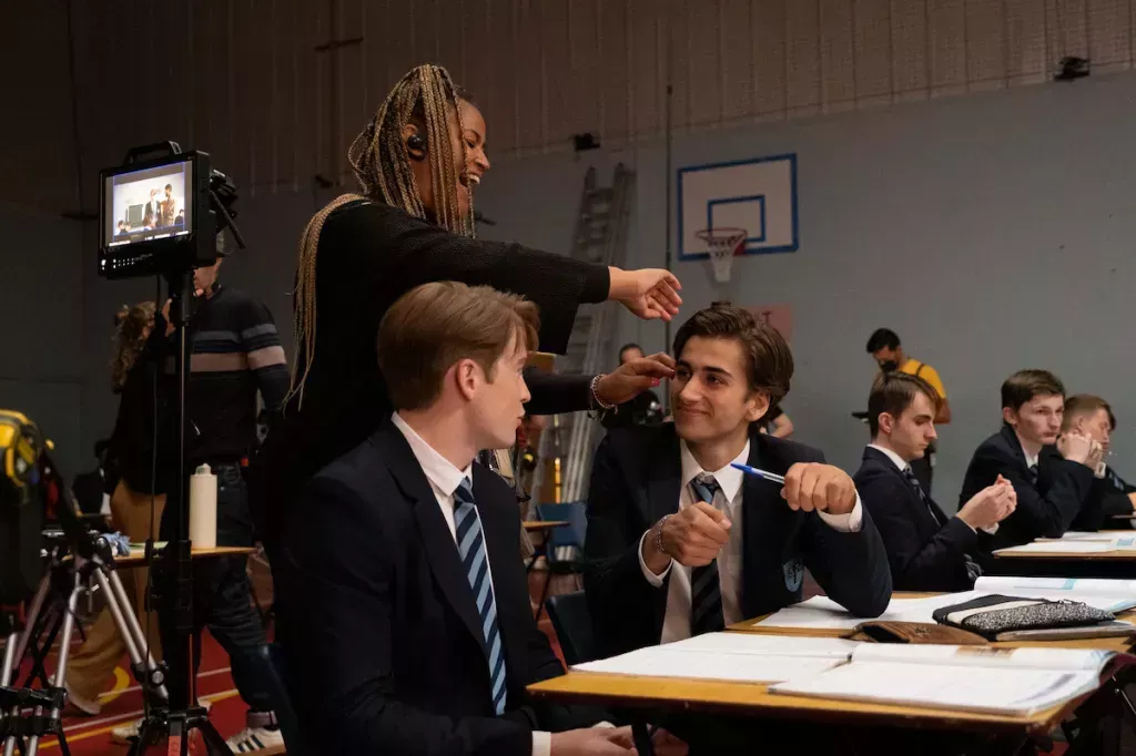 Sebastian Croft as Ben Hope, in school uniform, in Heartstopper behind the scenes beside Kit Connor