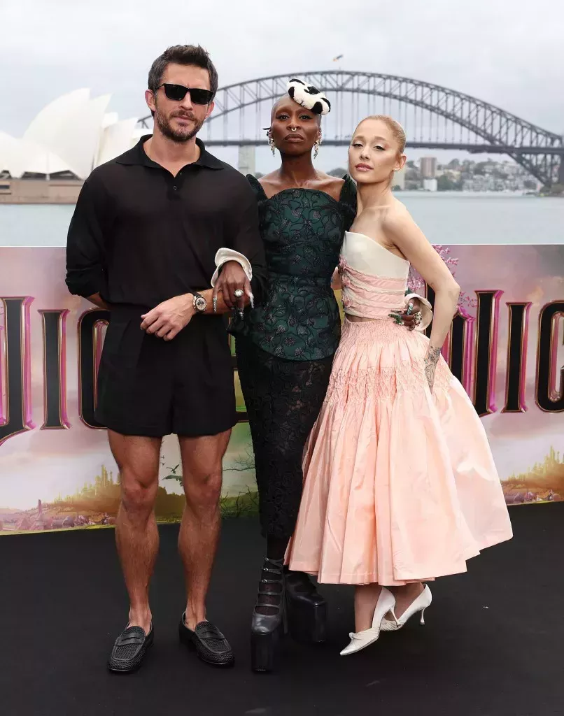 SYDNEY, AUSTRALIA - NOVEMBER 05: Jonathan Bailey, Cynthia Erivo and Ariana Grande pose for a photocall at Mrs Macquarie's Chair during the Australian premiere of "Wicked" at on November 05, 2024 in Sydney, Australia. (Photo by Don Arnold/WireImage)