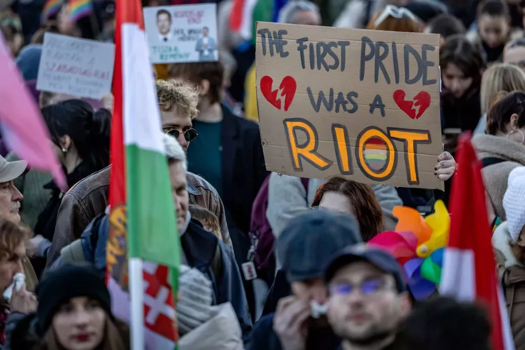 A demonstrator holds a banner during a protest on March 18, 2025 in Budapest, Hungary.
